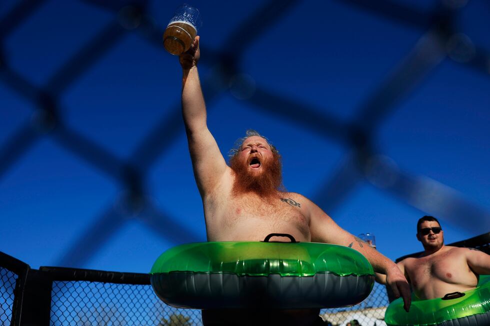 James "Manatee" Gordon raises his beer before taking on Cameron Cooper in the "Florida Sumo"...